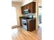 Kitchen with stainless steel oven and range, granite countertops, and wood cabinets at 1271 Whitlock Ridge Sw Dr, Marietta, GA 30064