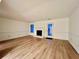 Spacious living room featuring hardwood floors, fireplace, and a glass paneled door at 1271 Whitlock Ridge Sw Dr, Marietta, GA 30064