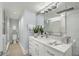 This bathroom features a white vanity and large mirror, with a glass-enclosed shower and toilet at 145 15Th Ne St # 1430, Atlanta, GA 30309