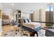 Bedroom features a large window with city views, bookshelf, and living area in the background at 145 15Th Ne St # 1430, Atlanta, GA 30309
