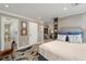 Primary bedroom leading into a bathroom, and featuring a stylish accent rug and large bed at 145 15Th Ne St # 1430, Atlanta, GA 30309