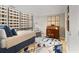 Bedroom featuring an accent rug, a desk, and large windows with city views at 145 15Th Ne St # 1430, Atlanta, GA 30309