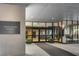 Elegant building entrance with a modern glass facade and Colony House signage at 145 15Th Ne St # 1430, Atlanta, GA 30309