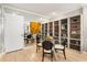 Modern dining area featuring a glass table, chairs, and built-in storage shelves at 145 15Th Ne St # 1430, Atlanta, GA 30309