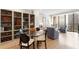 Modern dining area with a glass table, stylish chairs, and built-in shelving at 145 15Th Ne St # 1430, Atlanta, GA 30309