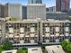 View of apartment building showing symmetrical design and urban surroundings at 145 15Th Ne St # 1430, Atlanta, GA 30309