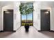 A quiet hallway features a potted tree that brings nature indoors at 145 15Th Ne St # 1430, Atlanta, GA 30309