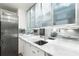 Modern kitchen featuring stainless steel appliances, marble countertops, and frosted glass cabinets at 145 15Th Ne St # 1430, Atlanta, GA 30309
