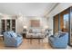 Cozy living room with hardwood floors, soft lighting, and balcony access at 145 15Th Ne St # 1430, Atlanta, GA 30309