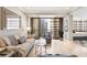 Bright living room featuring hardwood floors and a balcony with striking city views at 145 15Th Ne St # 1430, Atlanta, GA 30309