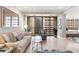 Bright living room featuring hardwood floors and a balcony with striking city views at 145 15Th Ne St # 1430, Atlanta, GA 30309