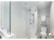 Modern tiled shower with glass enclosure, offering both a rain shower head and handheld sprayer at 145 15Th Ne St # 1430, Atlanta, GA 30309