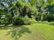 Spacious backyard surrounded by lush greenery, creating a private, nature-filled oasis at 2369 Christian Cir, Covington, GA 30016