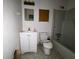 Bathroom with a toilet, a tub with shower, and a vanity with drawers for storage at 2369 Christian Cir, Covington, GA 30016