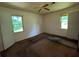 Spacious bedroom with large windows, ceiling fan, and ample natural light at 2369 Christian Cir, Covington, GA 30016