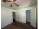 Bedroom with ceiling fan, closet, and open door at 2369 Christian Cir, Covington, GA 30016