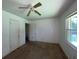 Bedroom with a ceiling fan and natural light through a window at 2369 Christian Cir, Covington, GA 30016