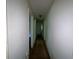 Hallway with neutral colored walls, leading to various rooms and offering a clear view of the layout at 2369 Christian Cir, Covington, GA 30016
