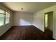 Spacious living room featuring hardwood floors, large windows, and neutral-colored walls at 2369 Christian Cir, Covington, GA 30016