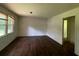 The living room has hardwood floors and white walls with many windows for natural light at 2369 Christian Cir, Covington, GA 30016