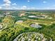 Aerial view of the community, surrounding greenery, and nearby infrastructure at 305 Hidden Creek Ln, Canton, GA 30114