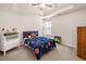 Bedroom featuring vaulted ceilings and a tray ceiling with a ceiling fan at 305 Hidden Creek Ln, Canton, GA 30114