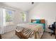 Bedroom with natural light, window views, and a ceiling fan at 305 Hidden Creek Ln, Canton, GA 30114