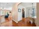 Elegant dining room featuring hardwood floors, stylish lighting, and easy access to living room at 305 Hidden Creek Ln, Canton, GA 30114