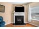 Cozy living room fireplace with a white mantle, perfect for relaxing evenings at 305 Hidden Creek Ln, Canton, GA 30114