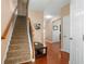 Bright foyer with hardwood floors, staircase and entry to the living areas at 305 Hidden Creek Ln, Canton, GA 30114