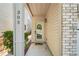 Welcoming front entryway with a decorative glass door and manicured landscaping at 305 Hidden Creek Ln, Canton, GA 30114