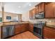 Modern kitchen with stainless steel appliances, granite countertops, and ample cabinet space at 305 Hidden Creek Ln, Canton, GA 30114