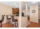 Stylish kitchen with breakfast bar and hardwood floors, ideal for casual dining at 305 Hidden Creek Ln, Canton, GA 30114