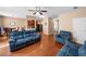 Spacious living room with hardwood floors, plush seating, and easy access to the kitchen at 305 Hidden Creek Ln, Canton, GA 30114