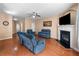 Inviting living room featuring a fireplace, hardwood floors, and comfortable seating at 305 Hidden Creek Ln, Canton, GA 30114