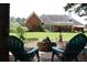 Expansive backyard featuring a cozy fire pit area with comfortable seating, and a view of the rear facade at 405 Mallory Cir, Loganville, GA 30052