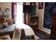 Bedroom featuring a bed, furniture, TV, window and decorated wall at 405 Mallory Cir, Loganville, GA 30052