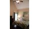 Cozy bedroom with high ceilings and dark hardwood floors at 405 Mallory Cir, Loganville, GA 30052