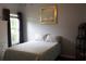 Comfortable bedroom with natural light from the window and neutral decor at 405 Mallory Cir, Loganville, GA 30052