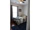 Compact bedroom features wood floors and a ceiling fan for added comfort at 405 Mallory Cir, Loganville, GA 30052