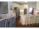 Modern kitchen featuring stainless steel appliances, granite countertops, and bar stool seating at kitchen island at 405 Mallory Cir, Loganville, GA 30052