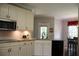 Well-equipped kitchen with white cabinets, granite countertops, and stainless steel microwave at 405 Mallory Cir, Loganville, GA 30052
