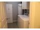 Laundry room with washer, dryer, cabinets and water heater at 405 Mallory Cir, Loganville, GA 30052