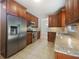 Modern kitchen with stainless steel appliances, granite counters and wood cabinets at 4133 Rosedown Nw Ct, Kennesaw, GA 30144