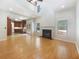 Open-concept living area with a fireplace and a view into the connected kitchen at 4133 Rosedown Nw Ct, Kennesaw, GA 30144
