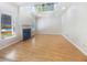 Spacious living room with hardwood floors, a fireplace, and abundant natural light at 4133 Rosedown Nw Ct, Kennesaw, GA 30144