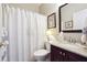 Charming bathroom featuring a vanity with granite countertop and a shower with a decorative curtain, providing a classic look at 5832 Sloane St, Douglasville, GA 30135