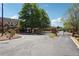 Community entrance with brick pillars and wrought iron gates, set against a backdrop of mature trees at 5832 Sloane St, Douglasville, GA 30135