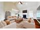 Bright living room featuring high ceilings, hardwood floors, a fireplace, and plenty of seating at 5832 Sloane St, Douglasville, GA 30135