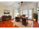 Home office with hardwood floors, a vaulted ceiling, plantation shutters, and a mahogany desk at 5832 Sloane St, Douglasville, GA 30135